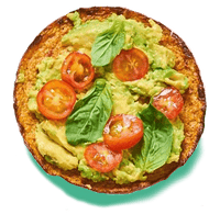 cauliflower sandwich thin topped with avocado, tomato and spinach