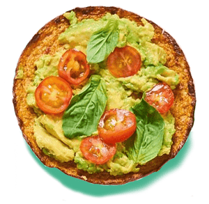 cauliflower sandwich thin topped with avocado, tomato and spinach